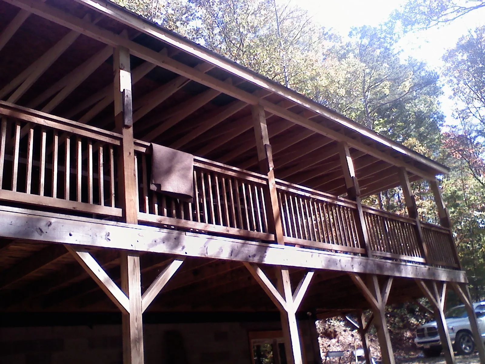 Timber framing under a new elevated porch and deck — Roof Leak Repair in Madera by Roofing Brothers